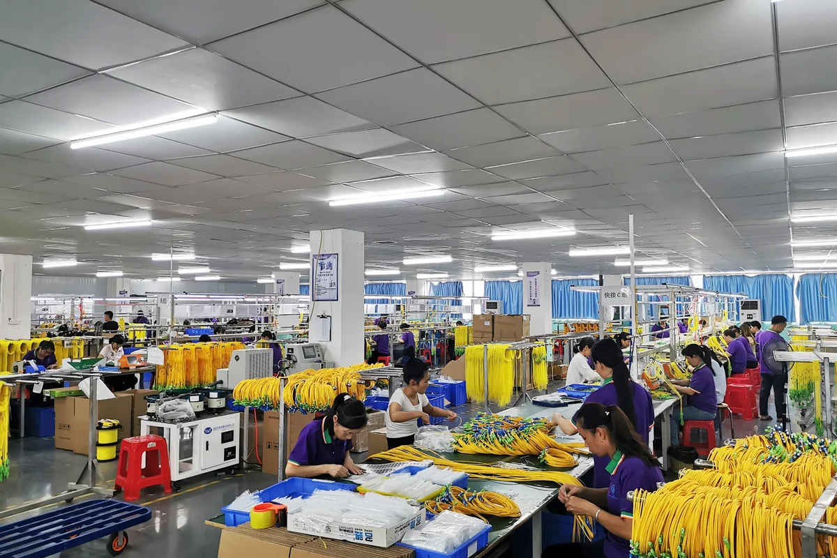 Fiber optic patch cord production and assembly line
