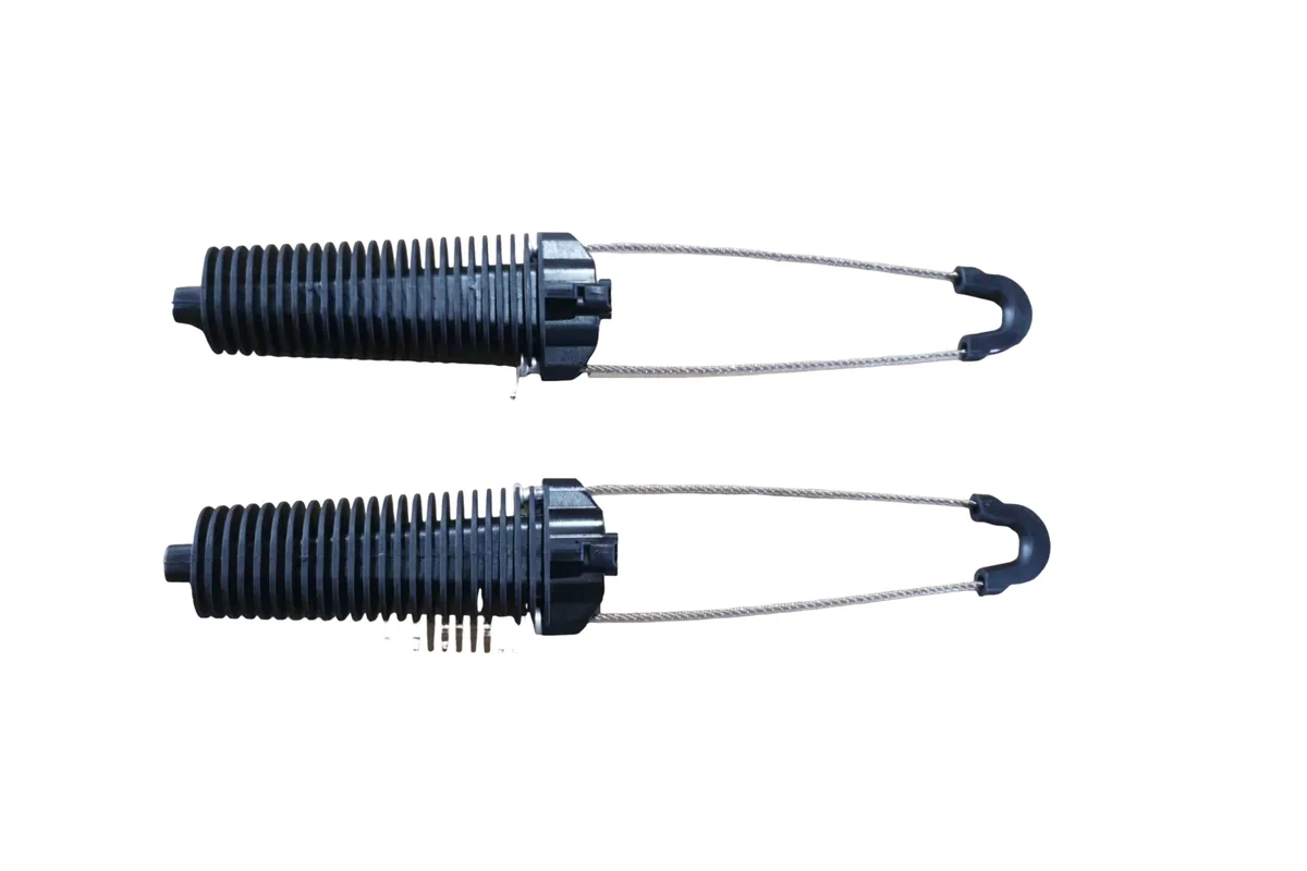 Drop cable clamps used with self-supporting aerial FTTH installation hardware