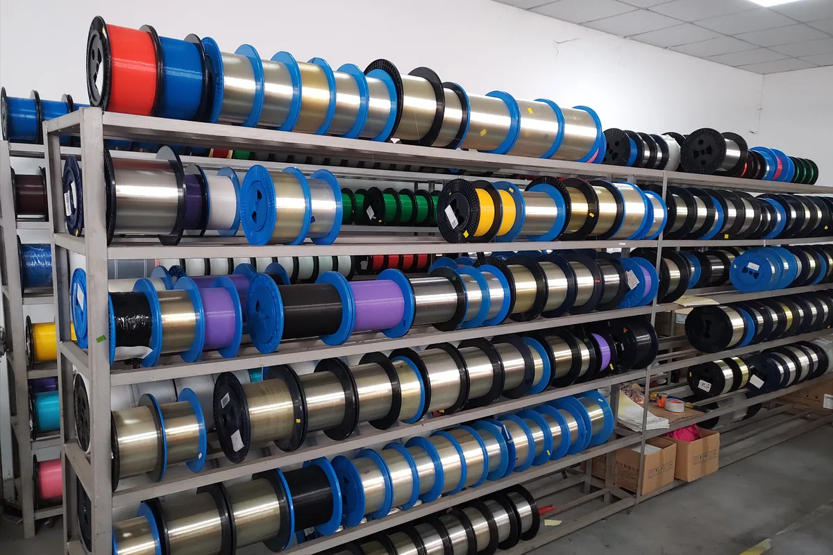 Optical fiber spools stored for fiber optic cable production