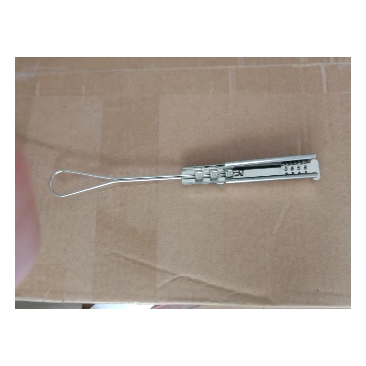 Complete front view of stainless steel drop wire cable clamp